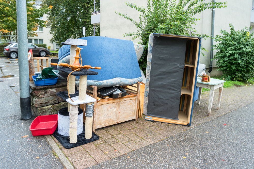 A pile of household unwanted junk items waiting to be haul-away